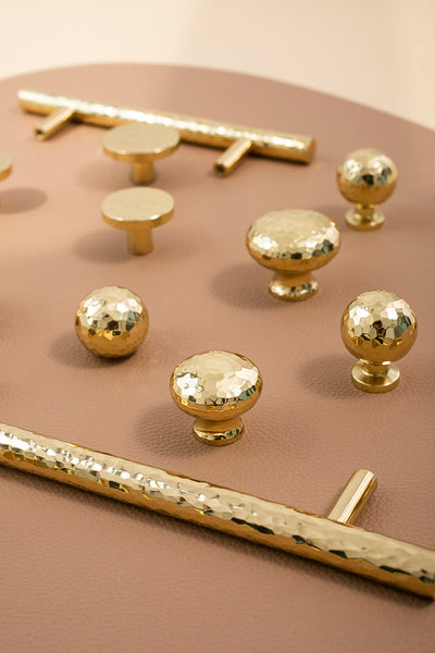 Nordic Gold Polished Hand Hammered Cabinet door handles and knobs.