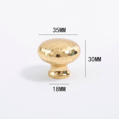 Nordic Gold Polished Hand Hammered Cabinet door handles and knobs.