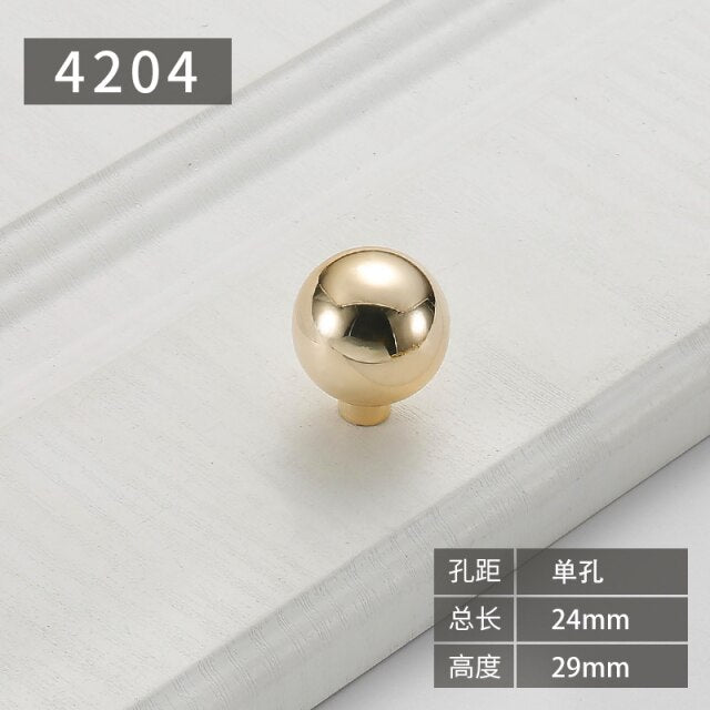 Gold polished cabinet door handles and knobs