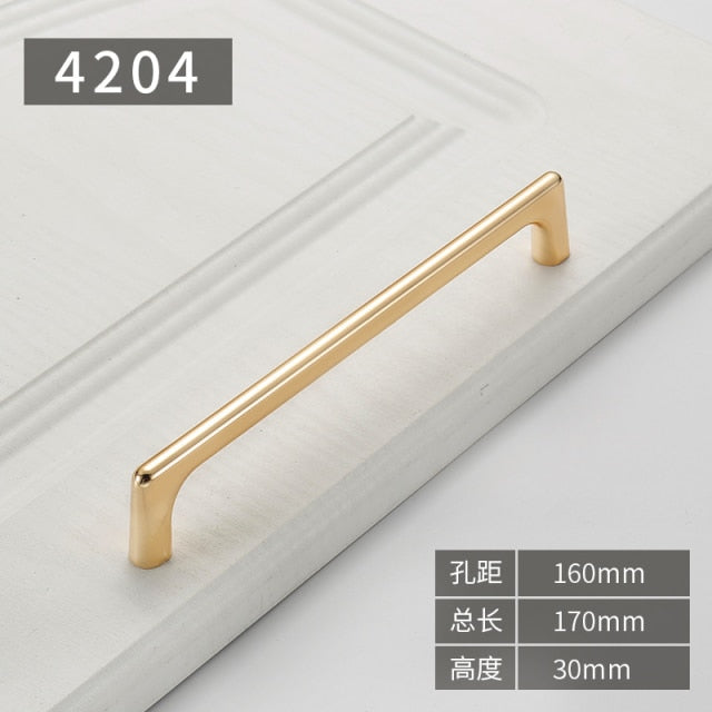 Gold polished cabinet door handles and knobs