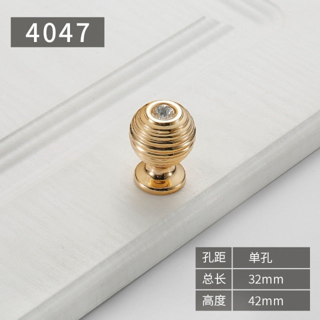 Gold polished cabinet door handles and knobs